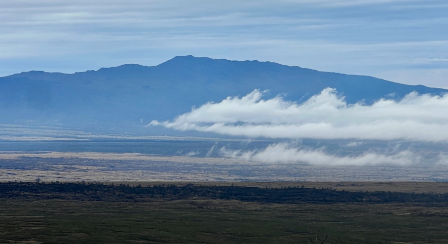 Hualālai Volcano viewed from Saddle Road, with clouds drifting across the high desert of the Big Island.