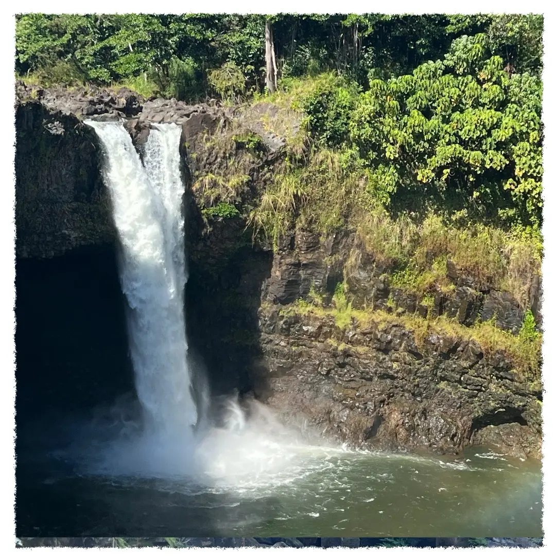 Rainbow Falls cascading into a rainforest basin near Hilo on the Big Island of Hawaiʻi.