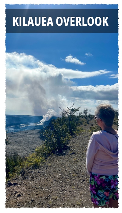 Visitor standing at a Kīlauea overlook watching volcanic steam rise from the crater in Hawaiʻi Volcanoes National Park